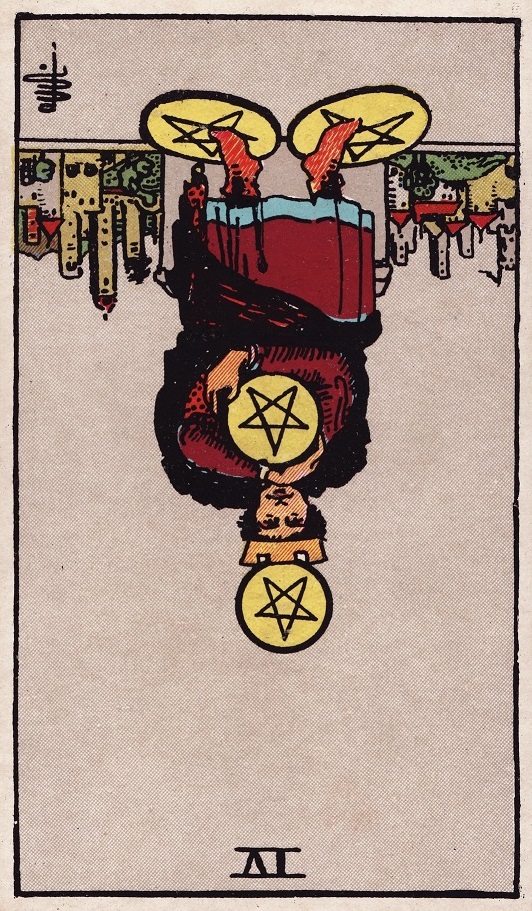 Four of Pentacles Tarot Card Reversed Meaning
