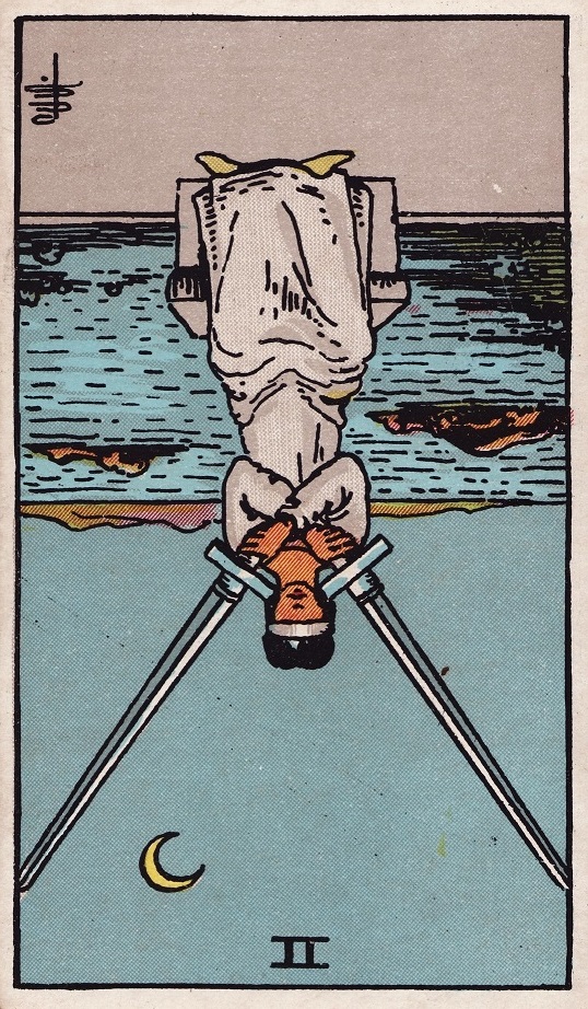 Two of Swords Tarot Card Reversed Meaning